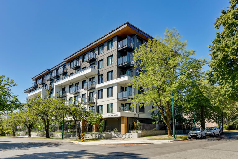 Exterior of The Hawthorn residential building with trees in front of it